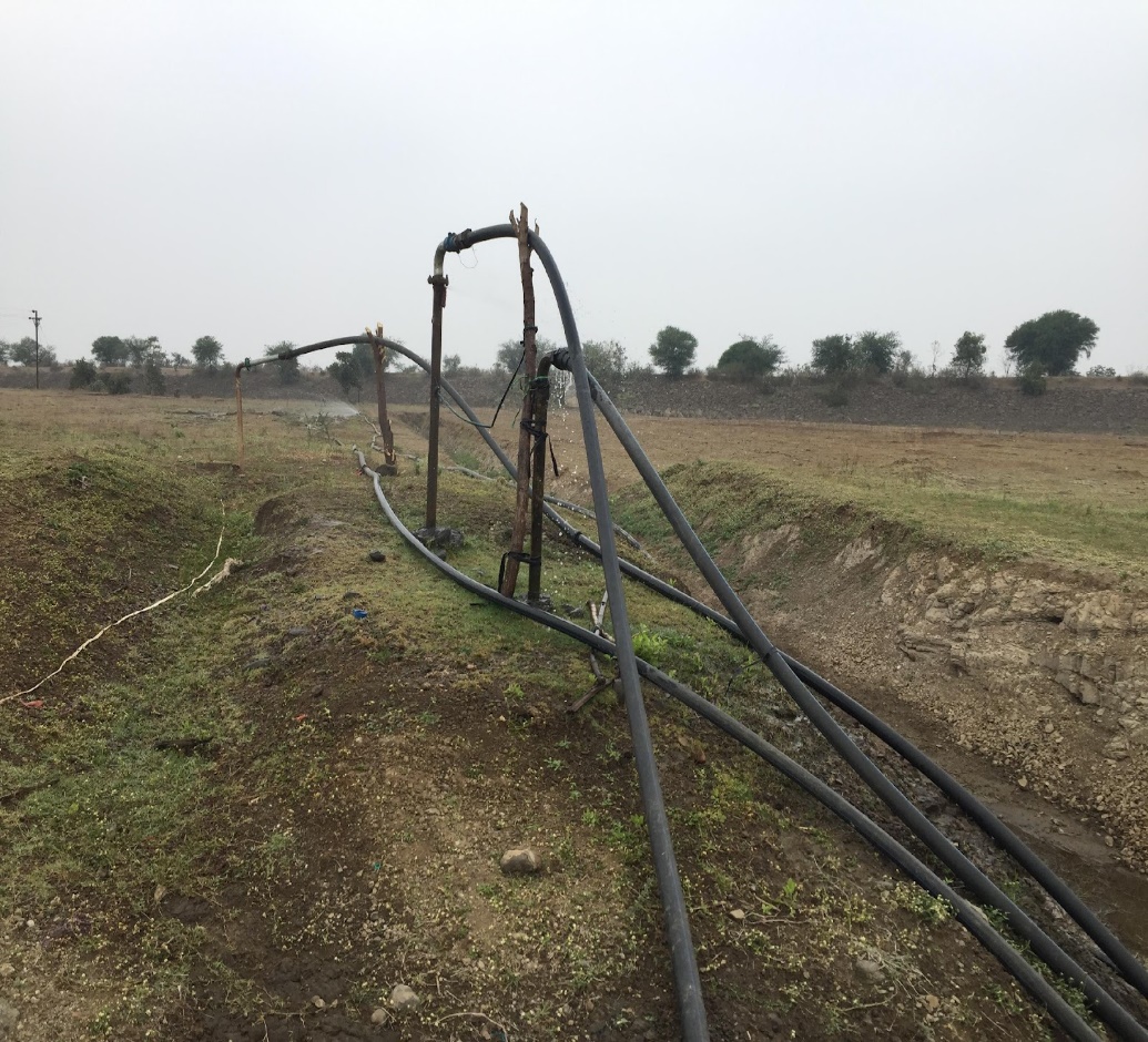 Water being pumped over 1 km from an irrigation tank in Umbarda Bazaar village, Washim